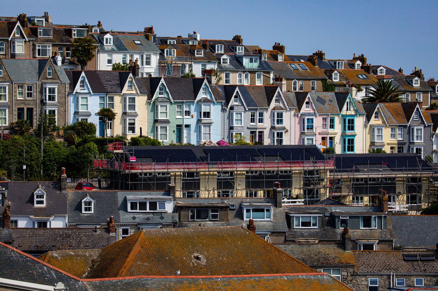 Rows of colourful terraced houses on a hillside